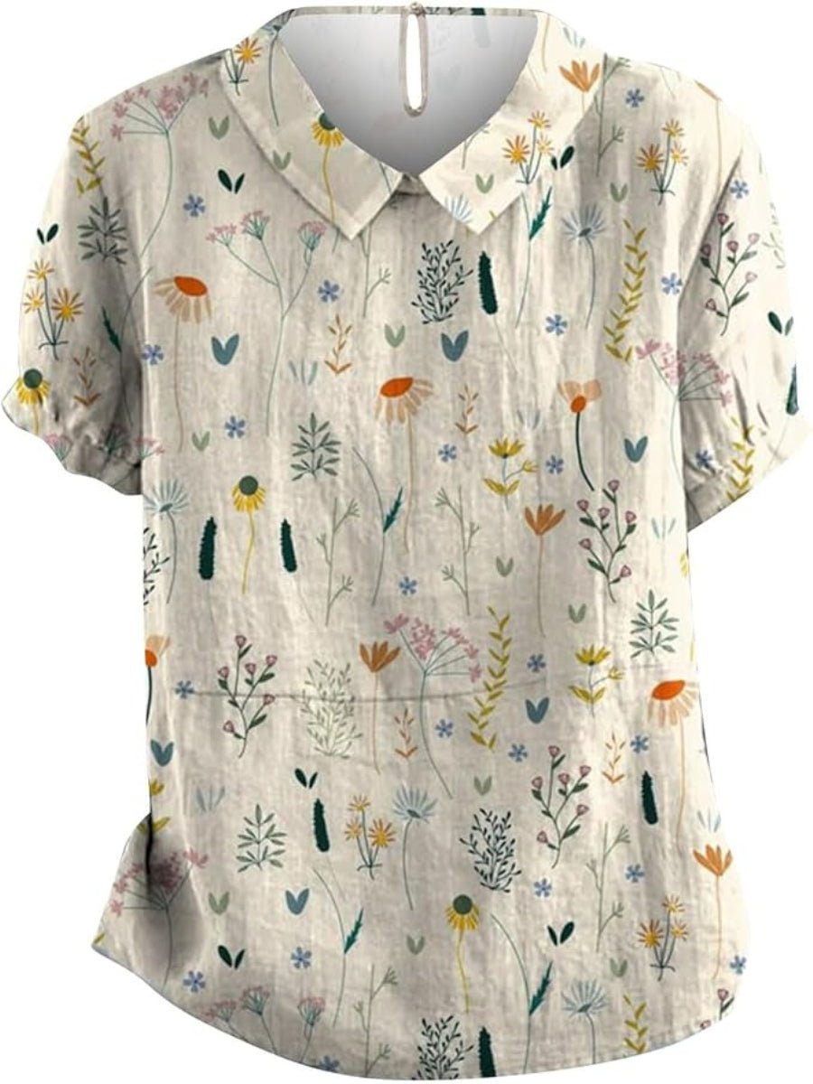 Stilfuld dame polo med blomsterprint og klassisk krave, designet med løs pasform for en moderne forårslook.