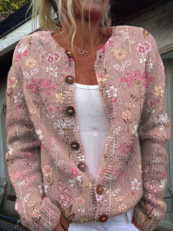 Elegant damecardigan med smukt blomstermønster i strik. Langærmet og komfortabel til modebevidste kvinder.