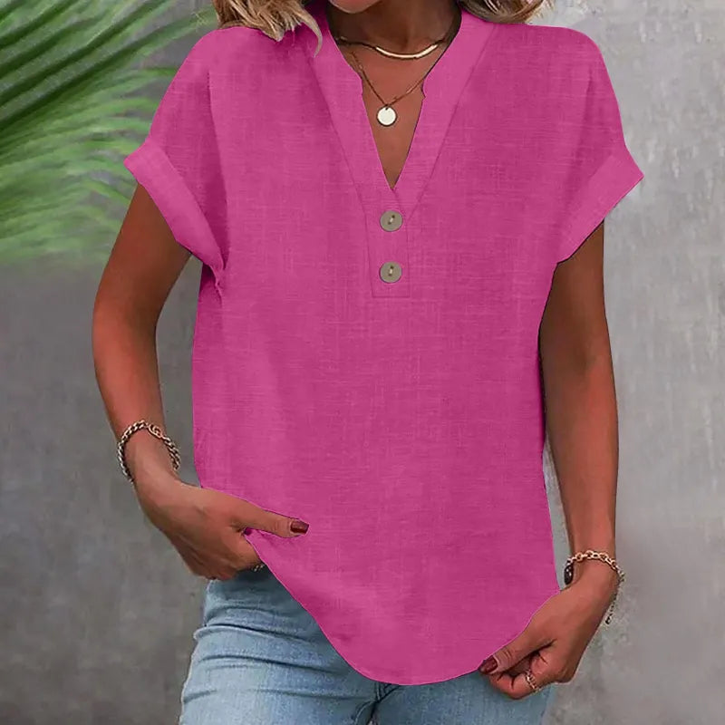 Klassisk damebluse med V-udskæring og knapper. Løs pasform til en afslappet og stilfuld sommerlook.