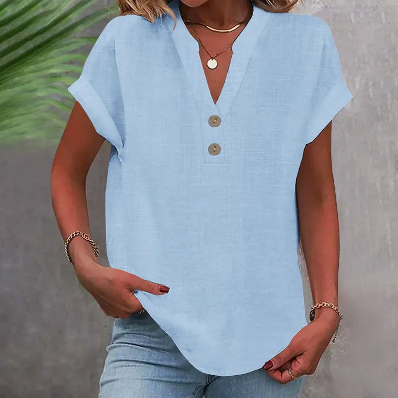 Feminine damebluse med V-udskæring og knapper, perfekt til en afslappet dag. Løs pasform for maksimal komfort.