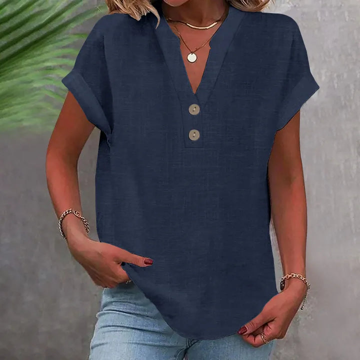 Trendy dame sommerbluse med V-udskæring, knapper og løs pasform. Ideel til afslappede og feminine outfits.