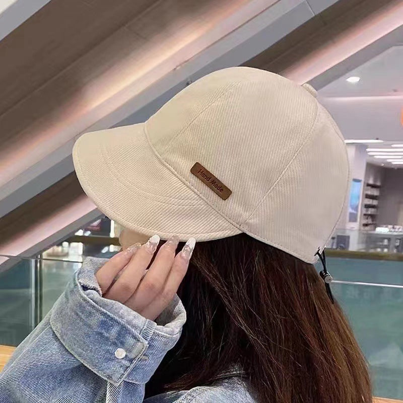 Kvinders UV-beskyttelseshat med bred skygge, foldbar, i sort, beige, khaki eller blå til udendørs aktiviteter.