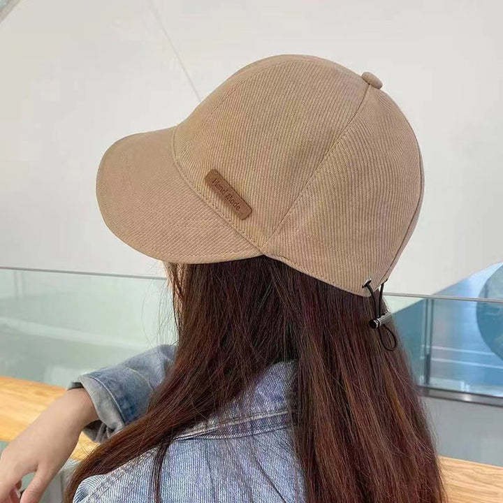 Kvinders UV-beskyttelseshat med bred skygge, foldbar, i sort, beige, khaki eller blå til udendørs aktiviteter.