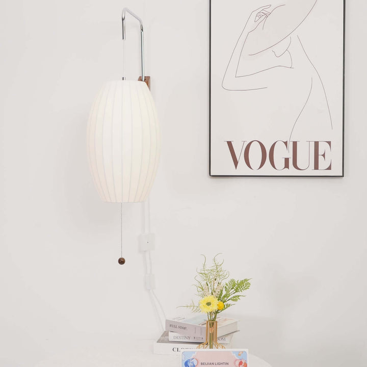 Moderne væglampe med kugledesign og varmt hvidt lys