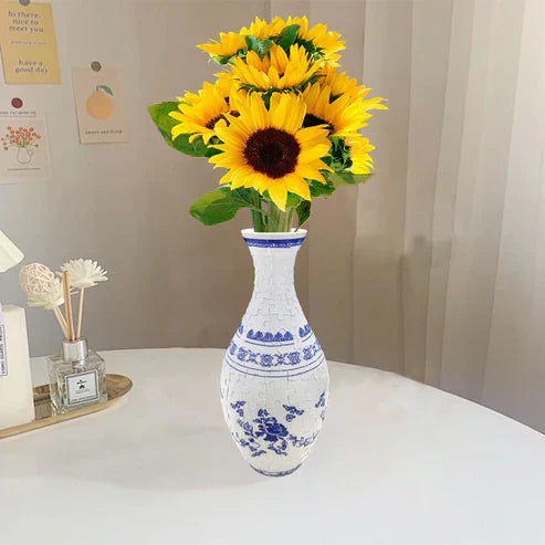 Børn og voksne samler en 3D puslespil vase, sjovt og kreativt tidsfordriv for alle.