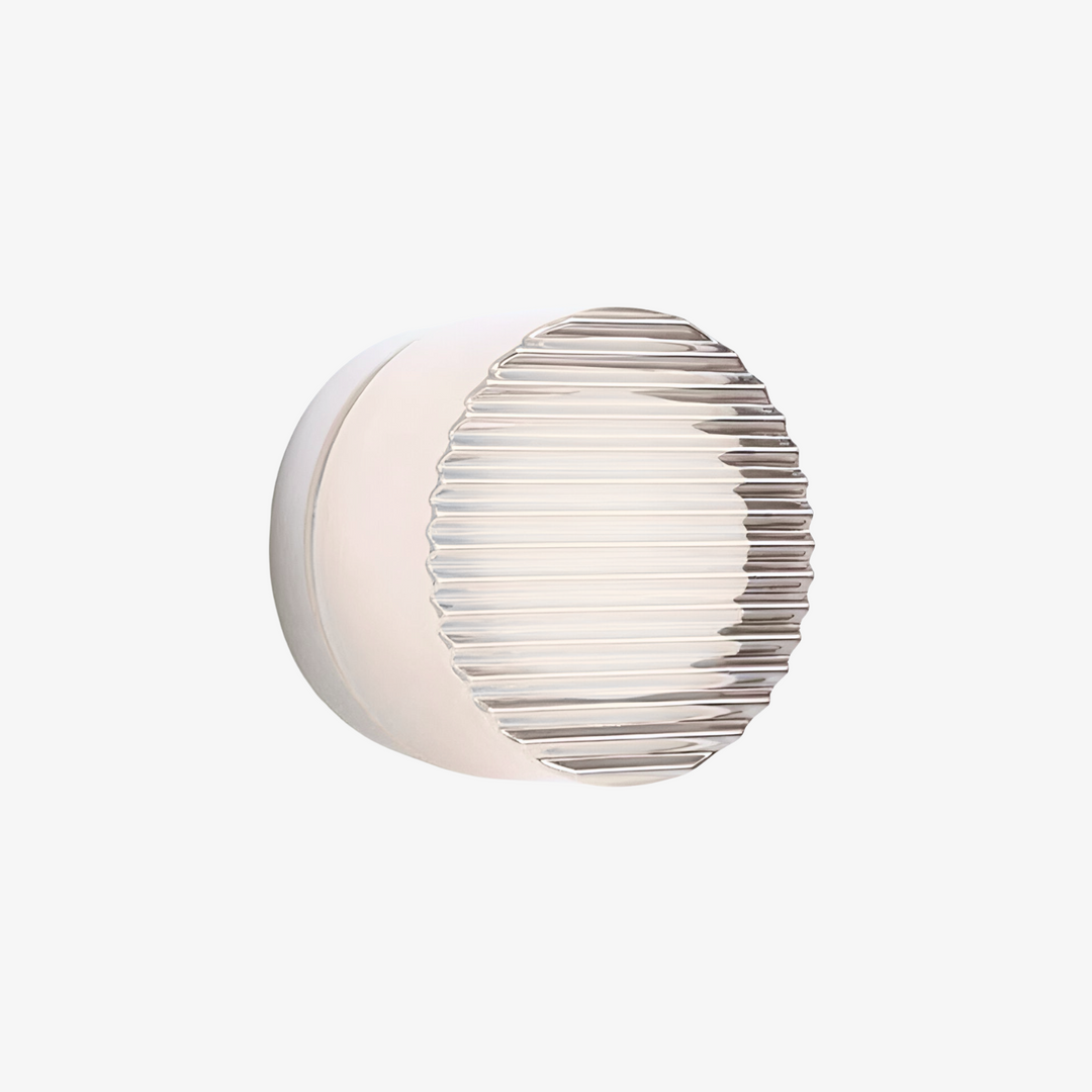 Stilfuld væglampe med rundt design. Dekorativ belysning, der komplementerer enhver indretning.