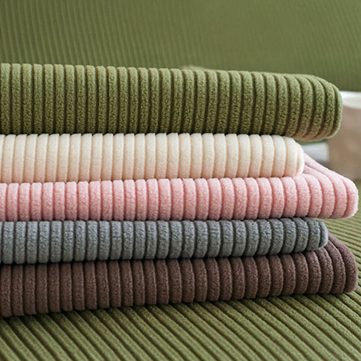 Elastisk fløjls-sofabetræk med elegante lodrette striber, passer til moderne stuer.