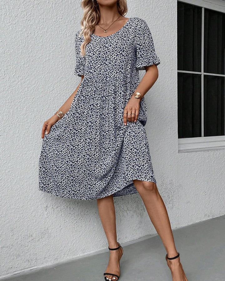 Elegant blomstret midikjole til kvinder. Lang sommerkjole med smukt blomsterprint, perfekt til fest.