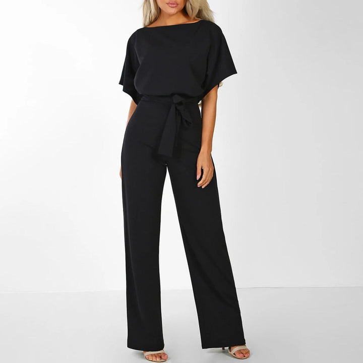 Clarissa fest jumpsuit med bælte. Elegant og tidløs dame jumpsuit, perfekt til aftenbrug.