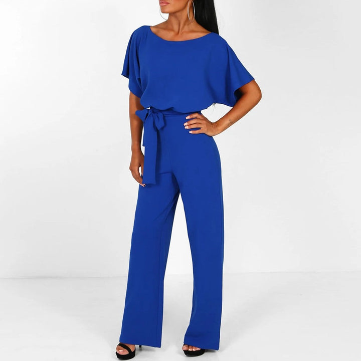 Moderne Clarissa dame jumpsuit med bælte. Et chikt kontoroutfit eller festklar klassiker.