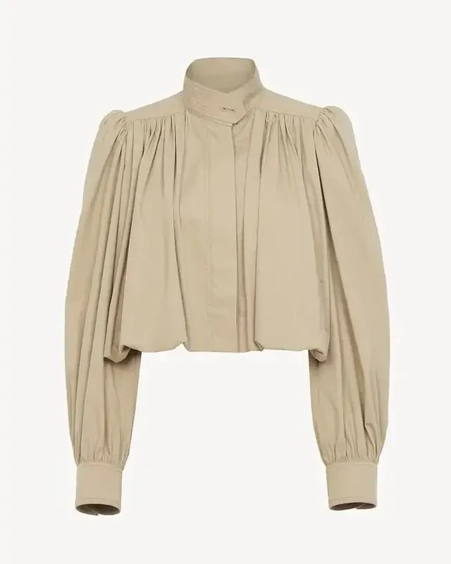 Elegant forårsjakke til kvinder. Katrine cropped bomberjakke med stilfulde puffærmer for et feminint touch.