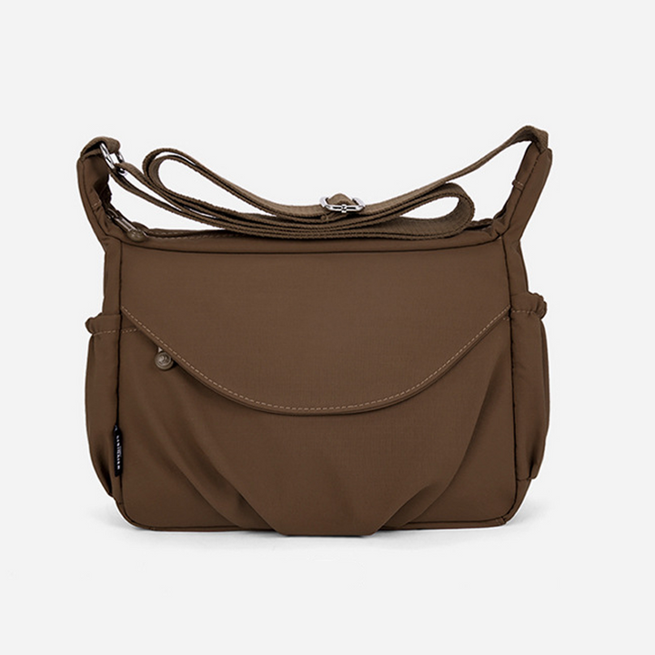 Blå stilfuld crossbody taske, med robust vandafvisende oxfordstof, til kvinder.