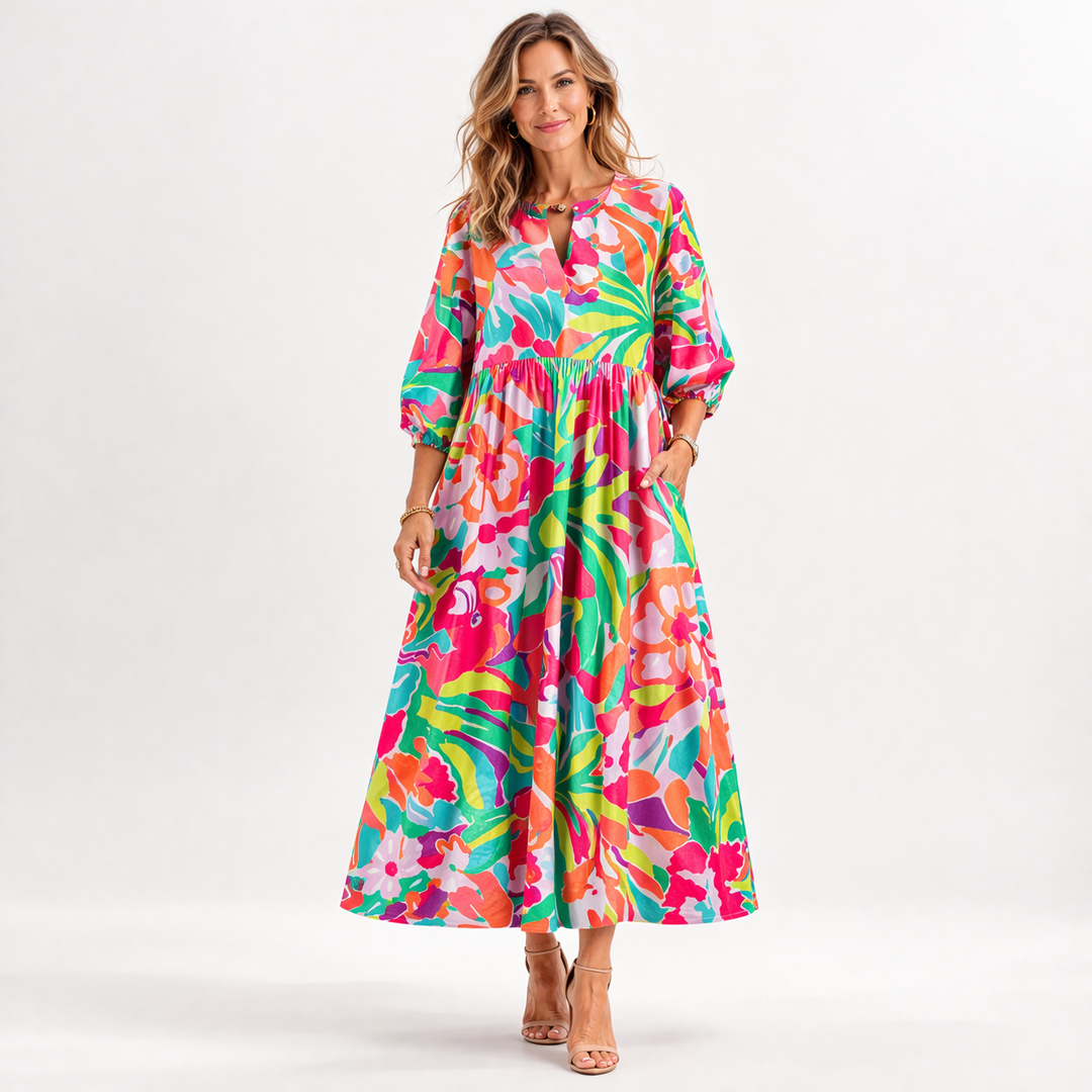 Elegant dame blomstret midi kjole med feminine pufærmer. Perfekt som festkjole eller sommerkjole.