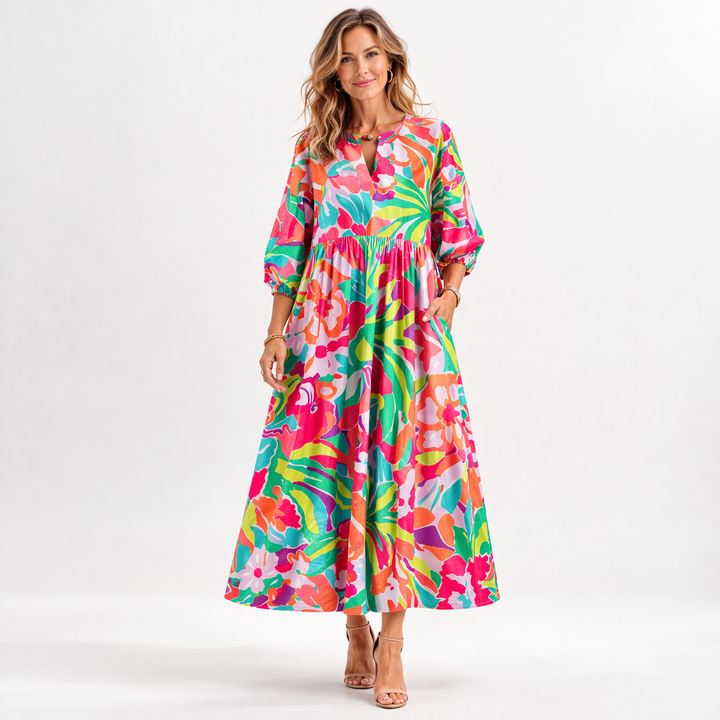 Elegant dame blomstret midi kjole med feminine pufærmer. Perfekt som festkjole eller sommerkjole.