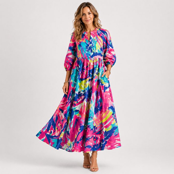 Moderne blomstret midi kjole med pufærmer. En feminin og elegant festkjole, perfekt til enhver lejlighed.