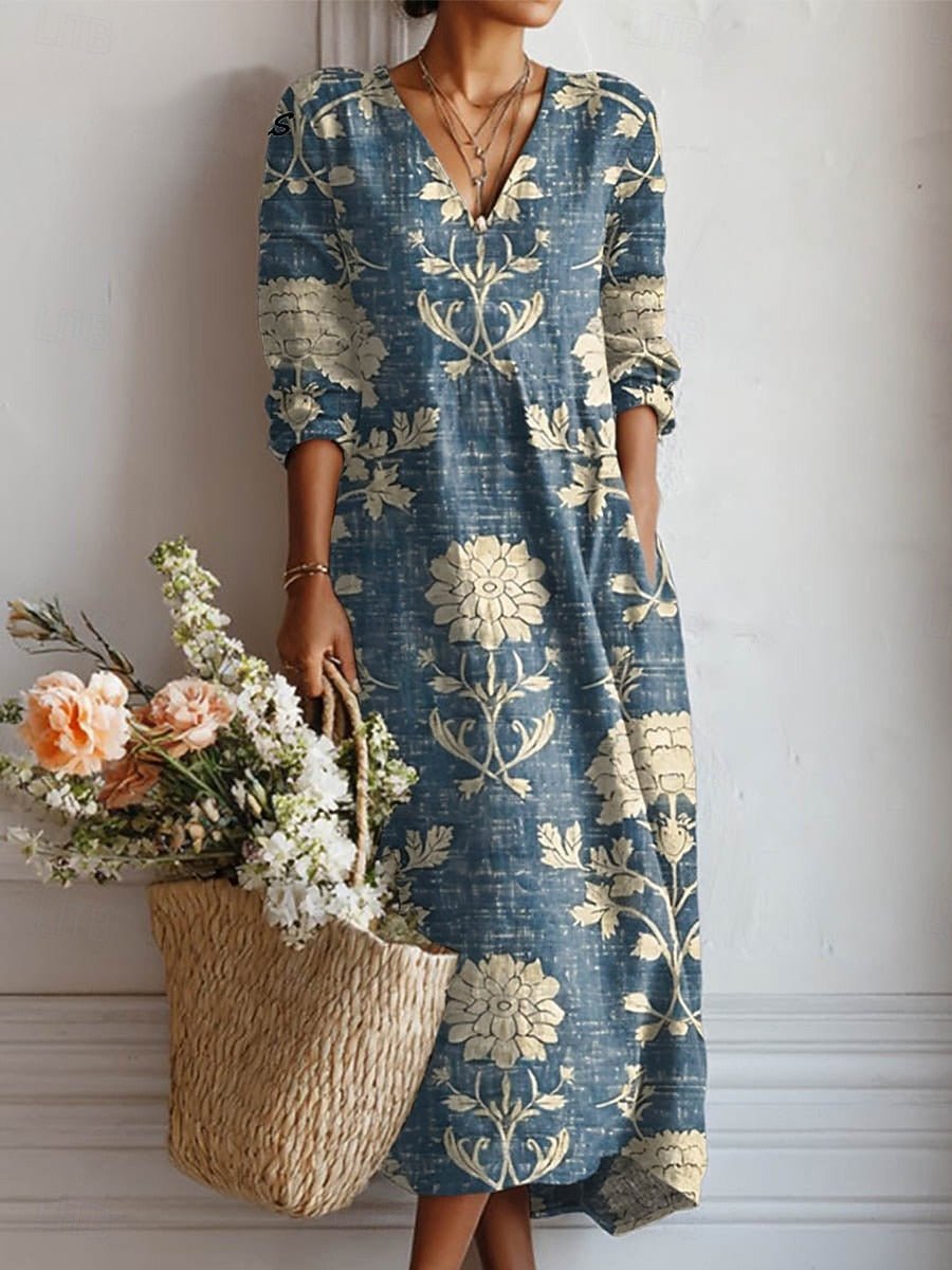 Elegant dame midi kjole med blomsterprint, V-hals og boho stil. Komfortabel sommer kjole med afslappet pasform.
