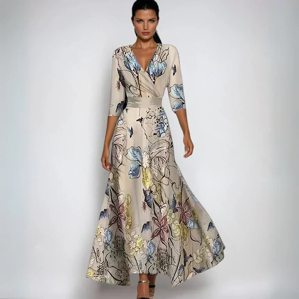 Feminin midi blomsterkjole med levende print, ideel som hverdagskjole eller festkjole.