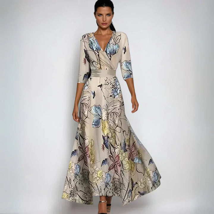 Feminin midi blomsterkjole med levende print, ideel som hverdagskjole eller festkjole.