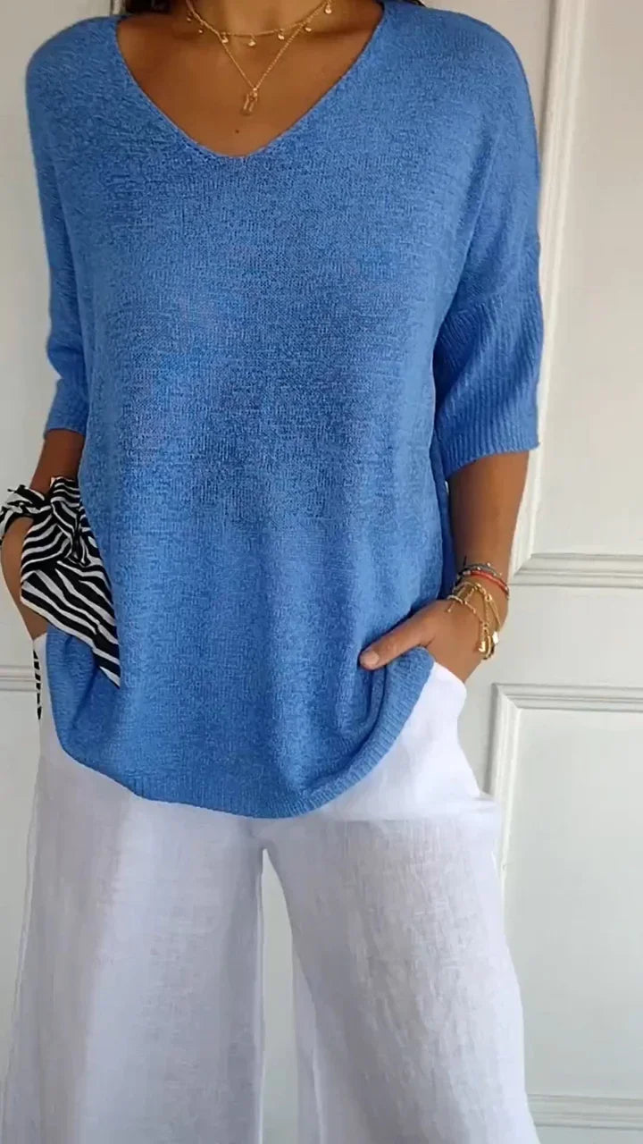 Alsidig dame V-hals strikketop i monokrom, ideel til både sommer og efterår, nem at style op eller ned.