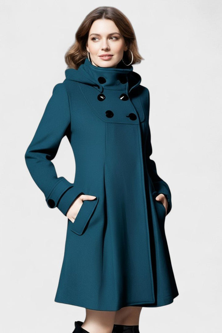 Elegant dame vinterfrakke med hætte. Mørk farve, ideel til kolde dage. Stilfuldt og varmt overtøj til kvinder.