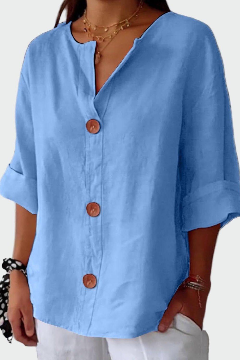 Tidløs damebluse med løs pasform og elegante knapper. Komfortabel stil til forår og sommer.