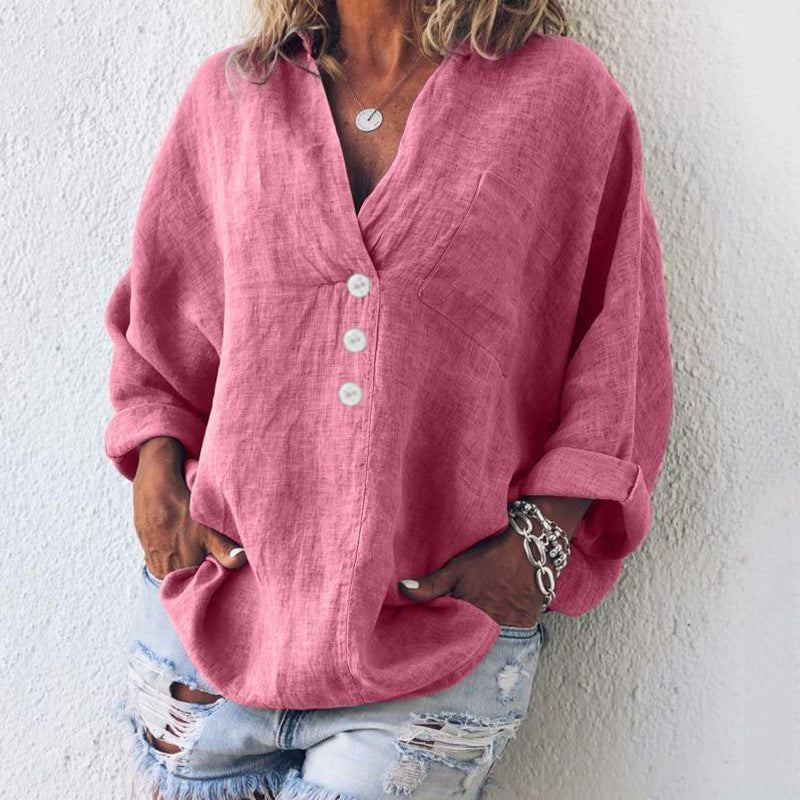 Elegant damebluse med v-hals, oversize pasform og rulleærmer. Perfekt sommerbluse til hverdag og komfort.