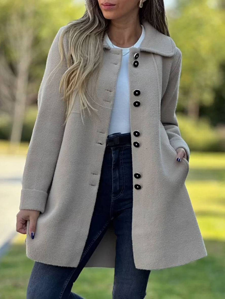 Elegant damefrakke i klassisk stil til efterår & vinter. Lang, varm overtøj med tidløst design.