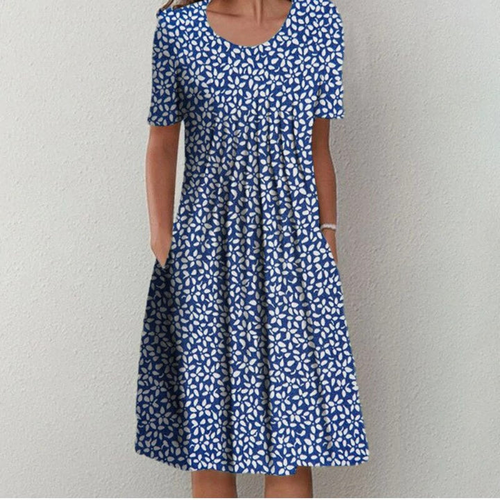 Elegant og komfortabel damekjole. Stilfuld sommerkjole til hverdag eller fest. Klassisk kvindemode, alsidig og farverig.