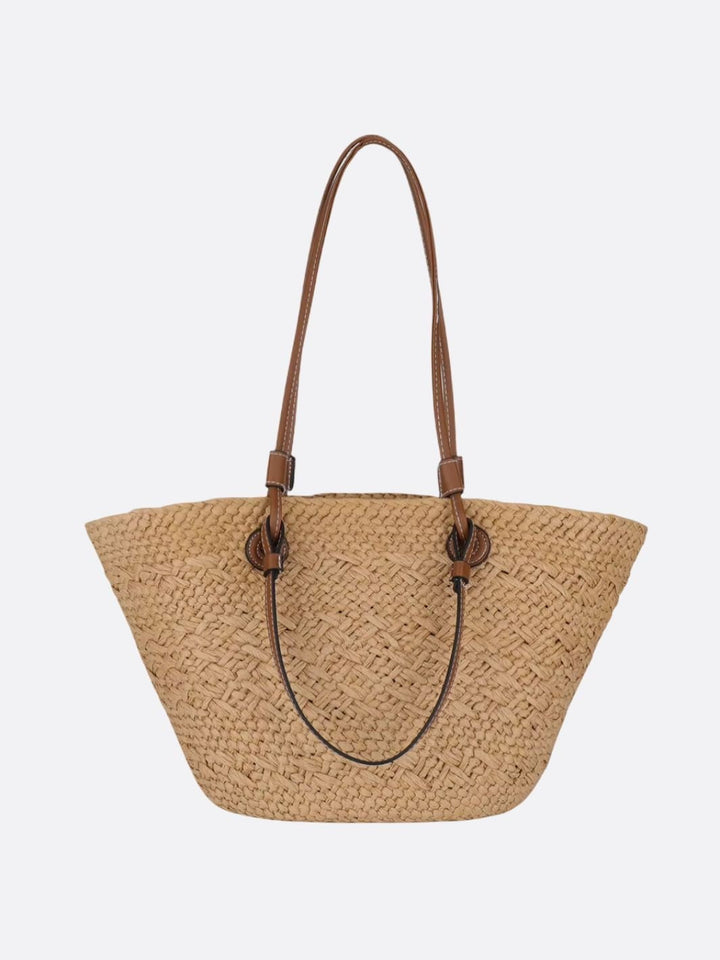Elegant flettet stråtaske til damer med læderdetaljer, perfekt som stilfuld sommertaske og hverdagstaske.