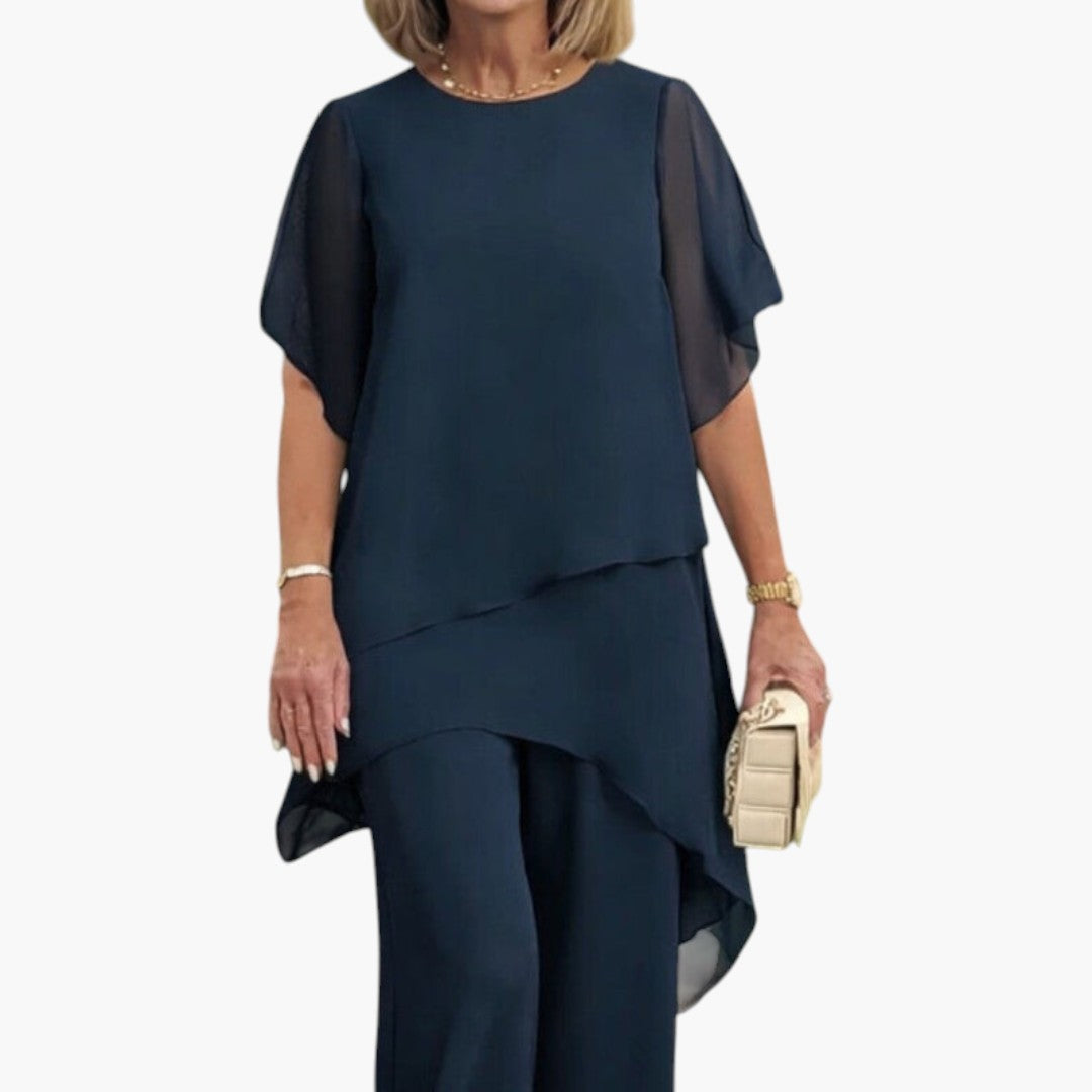 Moderne dametøj: Kvinders sæt med chic asymmetrisk top og elegante vide bukser. Perfekt til sommer.