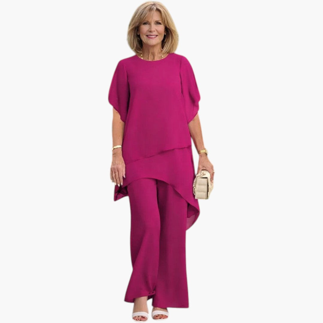 Stilfuldt sommersæt til kvinder: Asymmetrisk top og vide bukser for et elegant og behageligt look.
