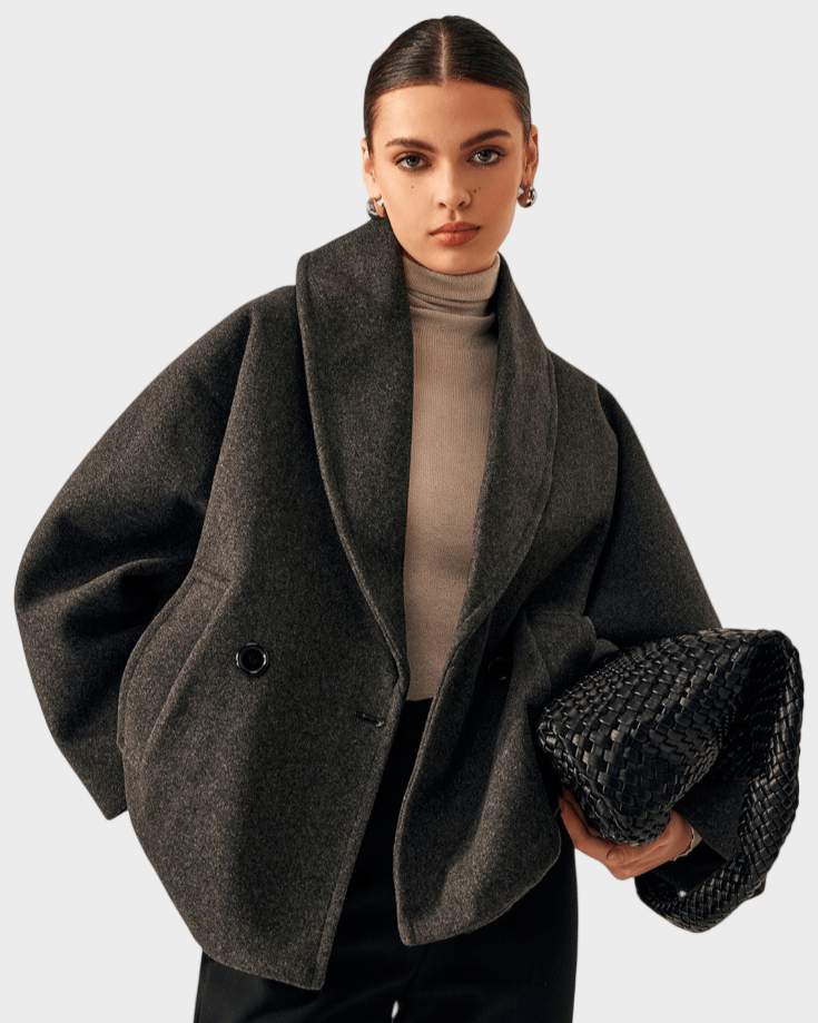 Elegant kvinders tweedfrakke, perfekt som varm vinterfrakke. Tidløst design til modebevidste kvinder.