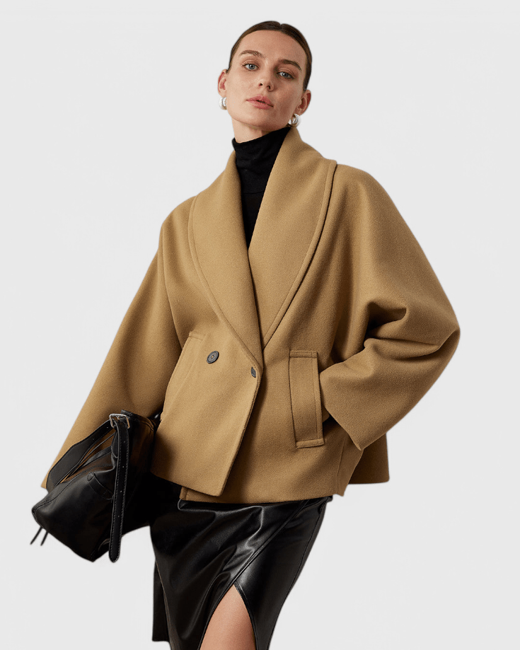 Stilfuld kvinders tweedfrakke, ideel som varm vinterfrakke. Kombinerer tidløs elegance med optimal komfort.