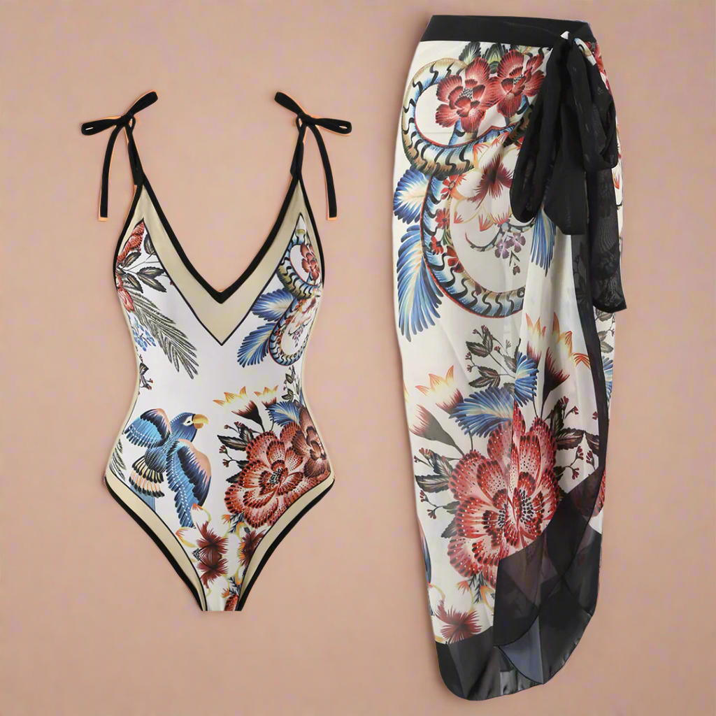 Kvinders justerbare strandsæt med stilfuldt blomster- og fugleprint. Ideel strandmode til en elegant sommerdag.