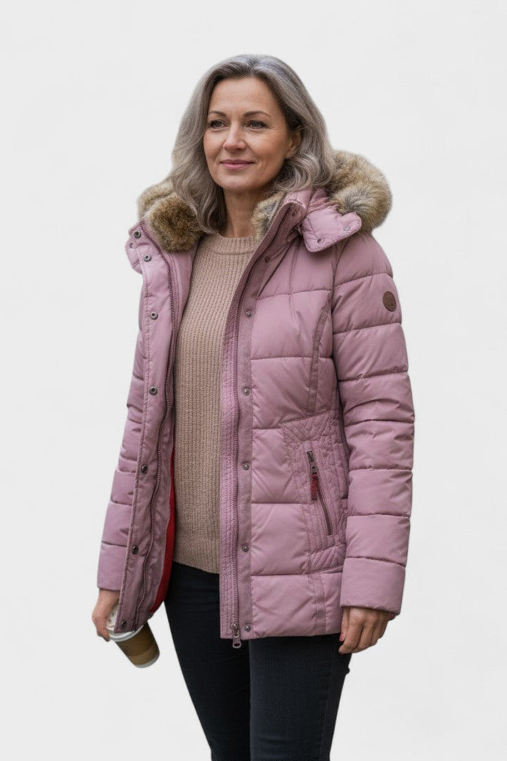 Elegant kvindevinterfrakke med pelsfor, perfekt til festlig dame mode i vintermånederne.