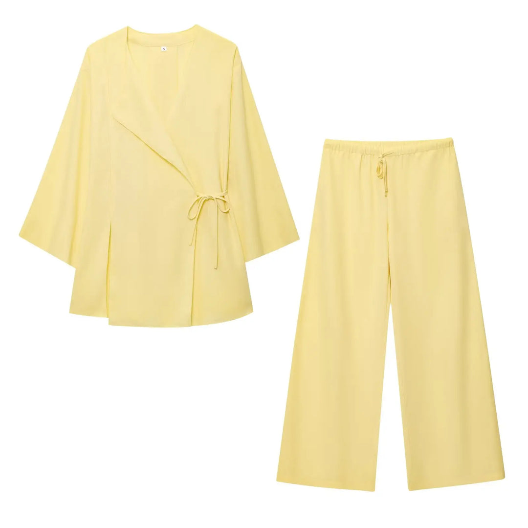 Kvinde pantsuit: Elegant løst jakkesæt med vide ben. Perfekt til komfortabel stil og festlige lejligheder.
