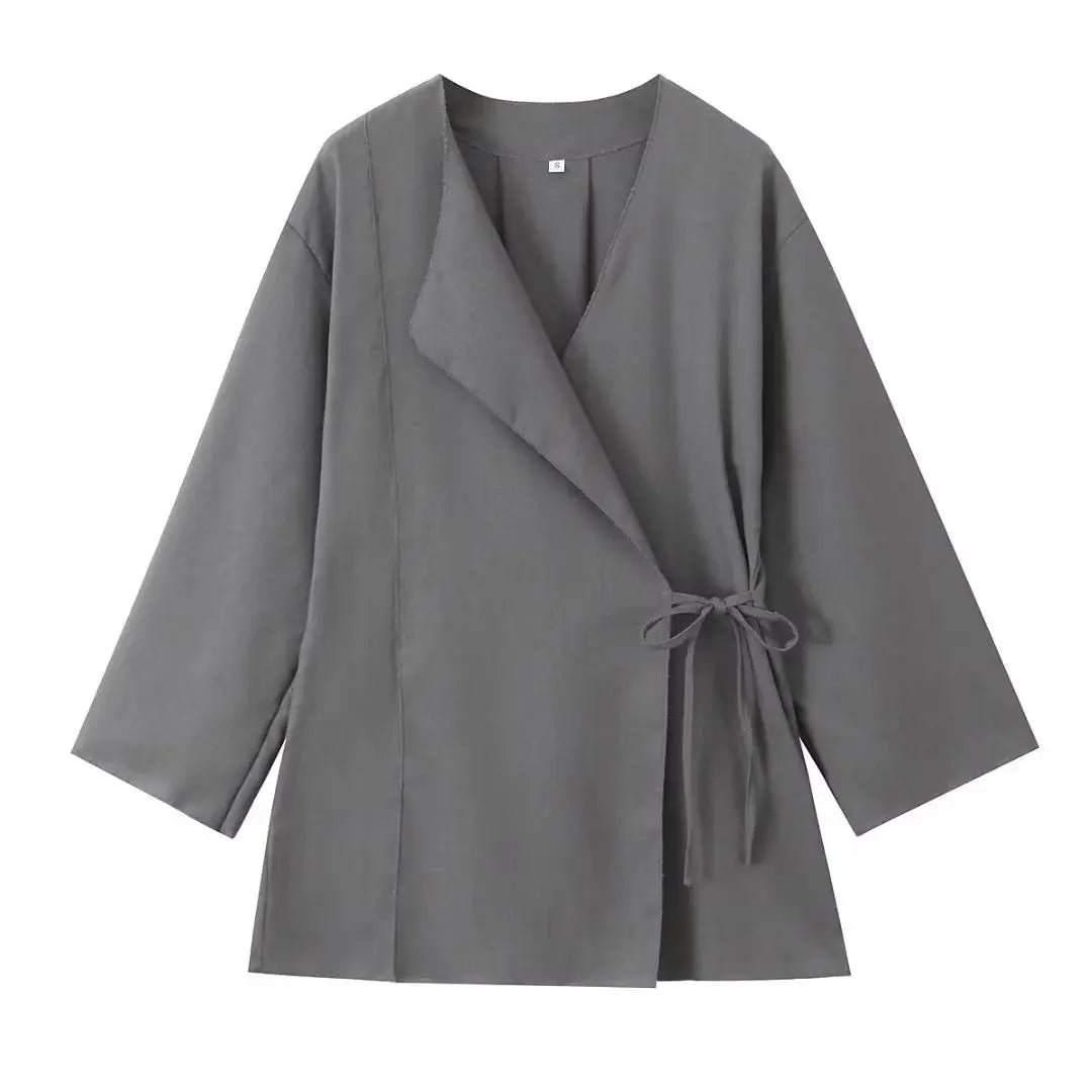 Komfortabelt todelt kvindesæt: Elegant løst jakkesæt med vide ben for en afslappet, stilfuld look.