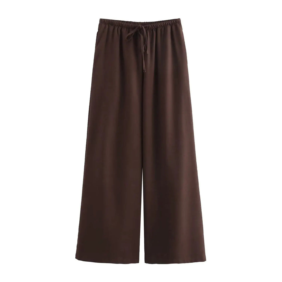 Flydende kvindejakkesæt: Løst, elegant design med vide ben. Ideelt for komfort og stil.