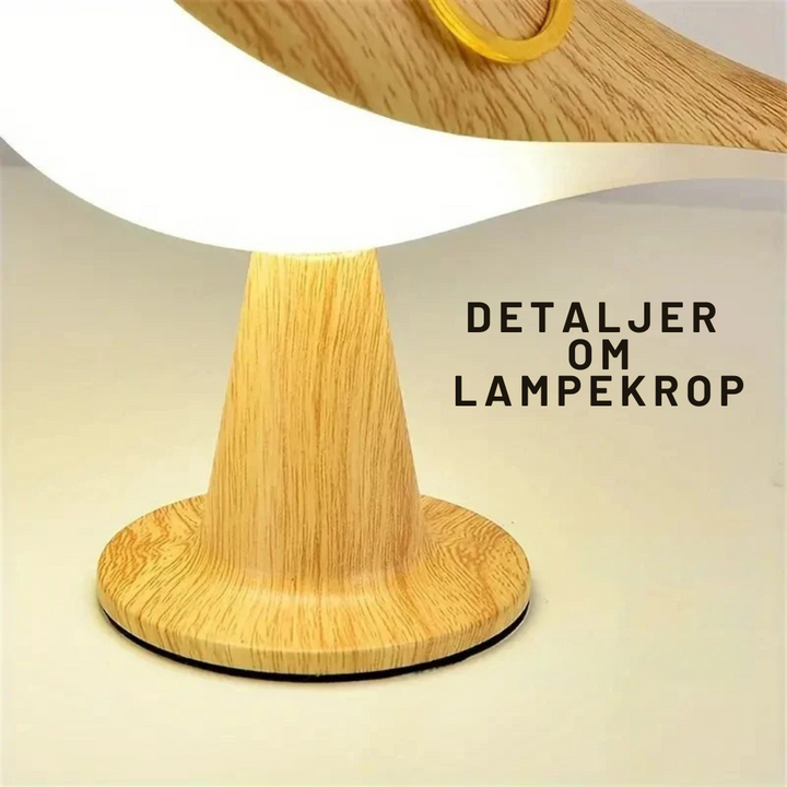 Elegant LED-bordlampe med dæmpbar lysstyrke, genopladelig for fleksibel brug som hyggelampe.
