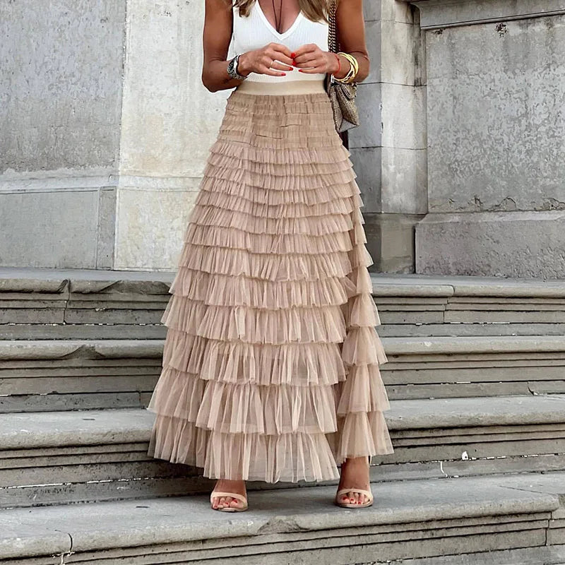 Elegant maxinederdel m. lagdelte flæser til kvinder. Lang, feminin flæsenenederdel til fest & hverdag. Romantisk stil.