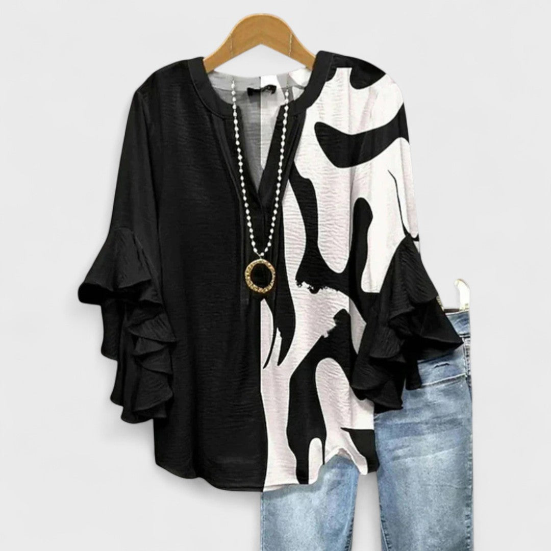 Alsidig kvindebluse, perfekt som en luftig og elegant sommerbluse for alle kropsstørrelser.