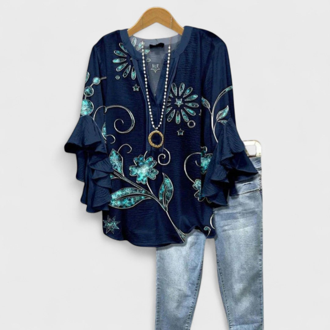 Elegant og alsidig damebluse i luftigt stof, ideel som letvægts sommerbluse til fest og afslappet.