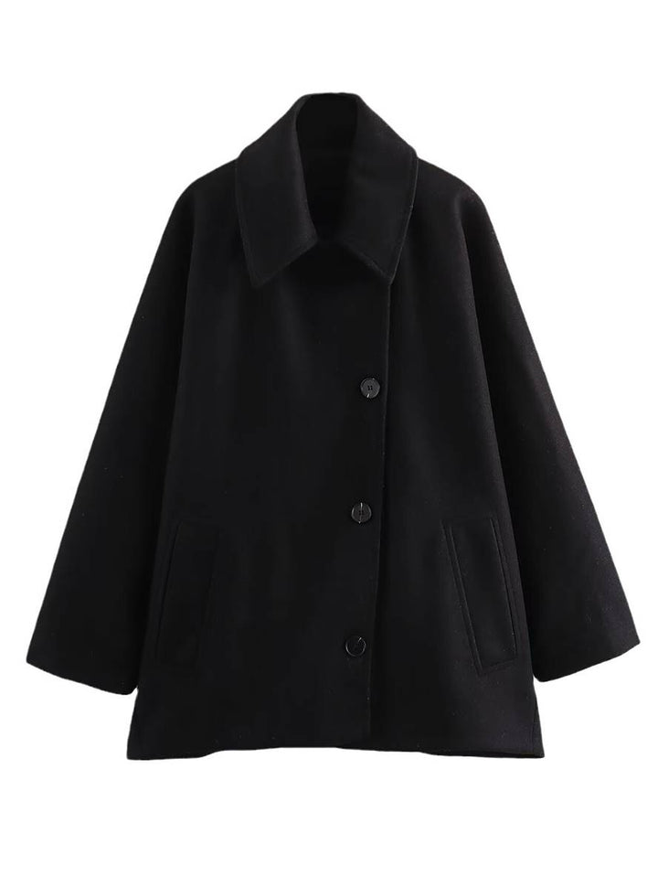 Chic midi-lang damefrakke med oversize pasform, reverskrave og unikke flagermusærmer. Varm uld.