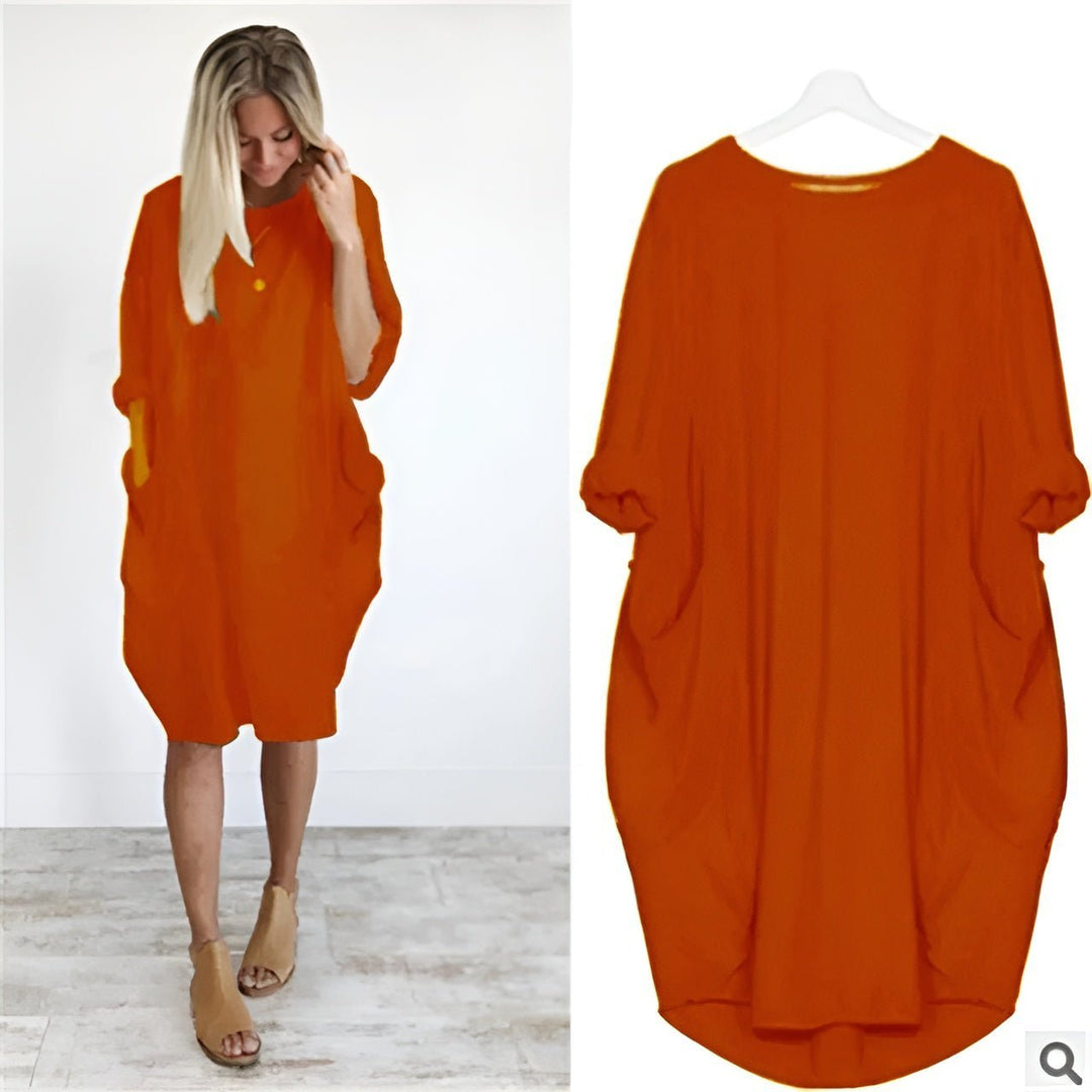 Komfortabel og stilfuld plus size kjole i sort med lommer og løs pasform. Perfekt til hverdagsbrug.