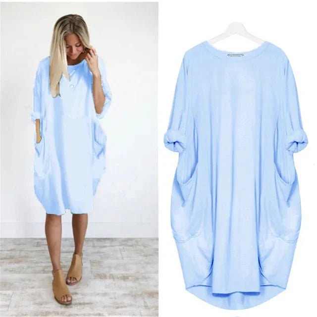 Stilfuld plus size kjole med lommer, løs pasform og farverigt design. Perfekt til sommerdage.