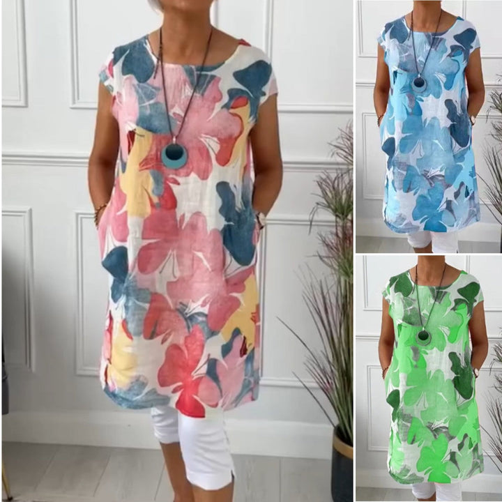 Afslappet hverdagskjole med smukt sommerfugleprint, en åndbar og komfortabel skjortekjole.