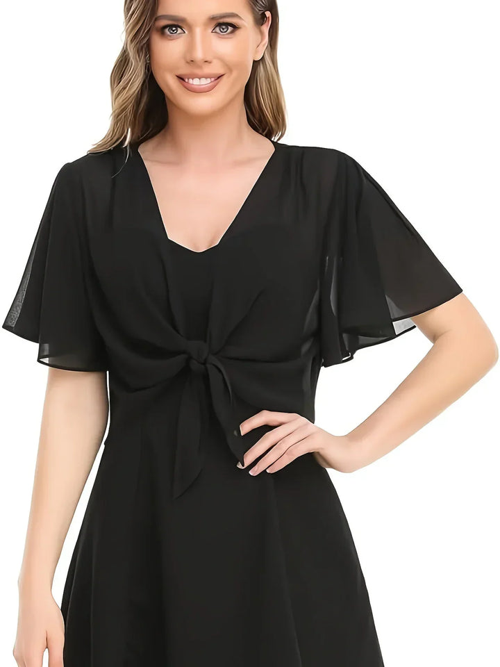 Elegant slå-om bluse til kvinder. Flatterende pasform og alsidig stil til enhver lejlighed.