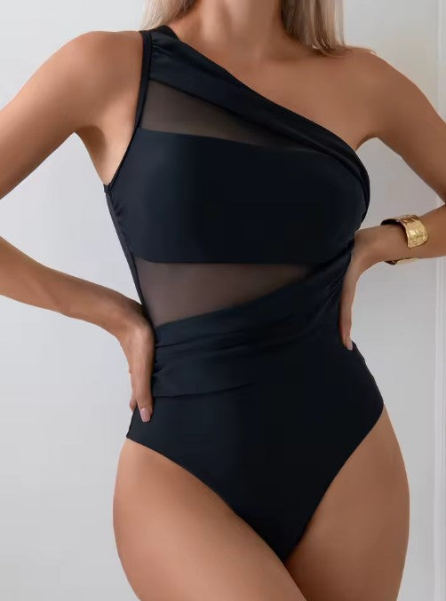 Elegant sort dame badedragt med asymmetrisk mesh, shaping & push-up. Perfekt kvindebadedragt til sommer og strandtøj.