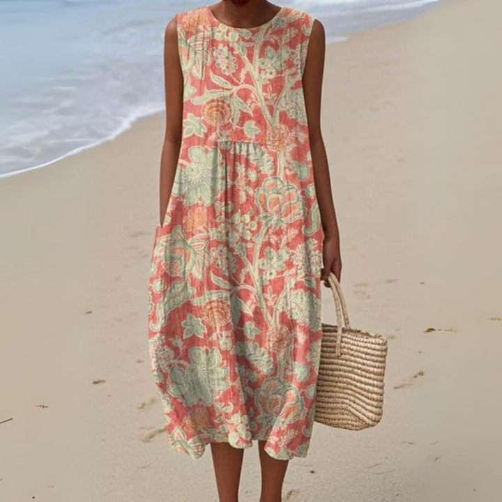 Elegant vintage blomstret maxikjole til kvinder i let, løs pasform. Perfekt sommerkjole med boho chic stil.