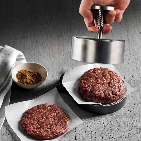 Ergonomisk hamburgerpresse i rustfrit stål, non-stick for perfekte, jævne burgere, nem at bruge.